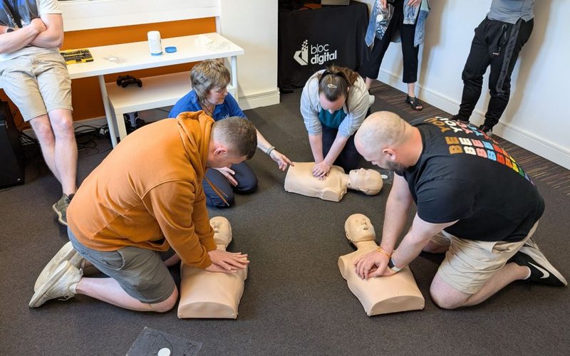 On-site Emergency First Aid at Work training session in a workplace setting