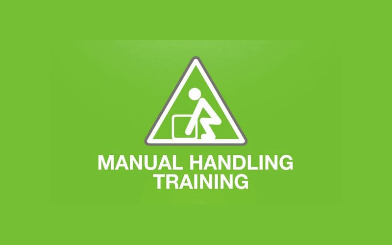 Manual handling training — staff practising safe lifting technique in a warehouse
